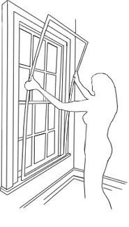 woman installing interior storm window vs replacement window