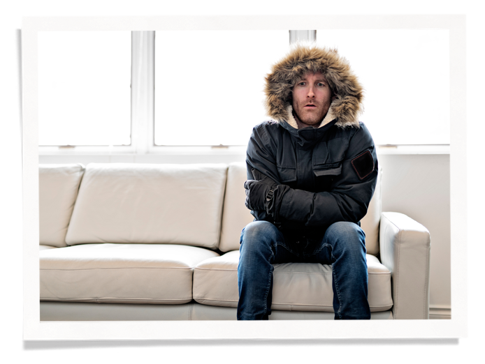 Cold family of 4 crowded for warmth next to window. Polar vortex forecasts allow time to prepare.